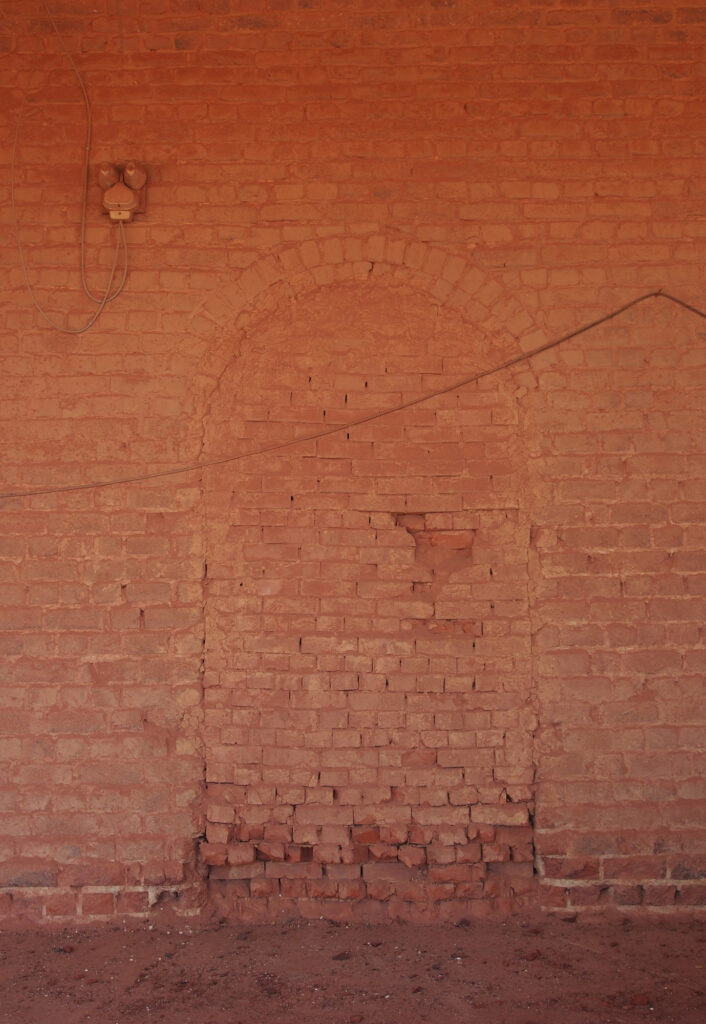 landscape photography of brick door